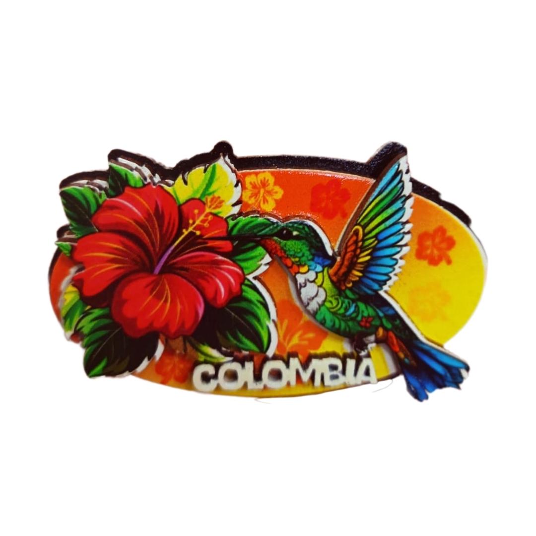Imán colibrí con flor roja